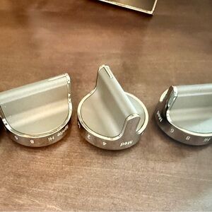 Silver and Gray Control Knobs